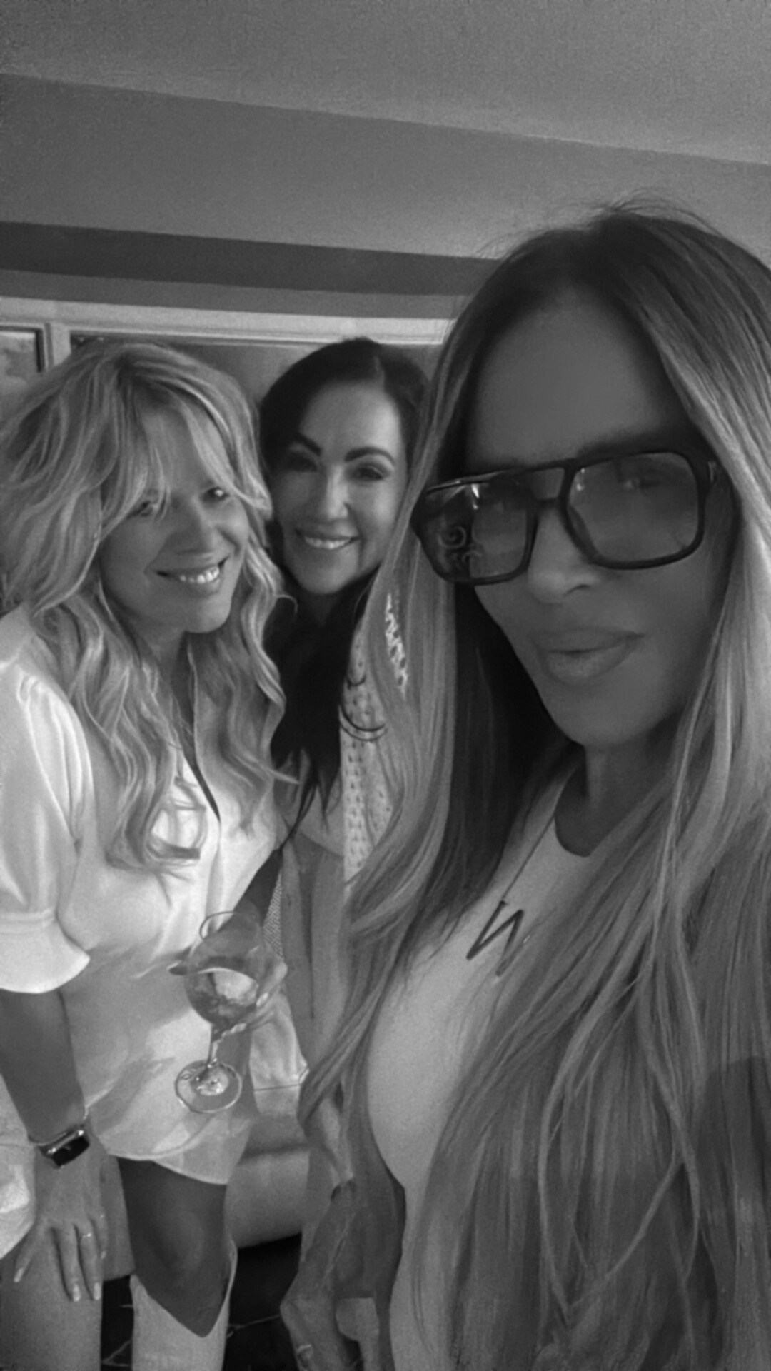 Friends dressed in white celebrating together